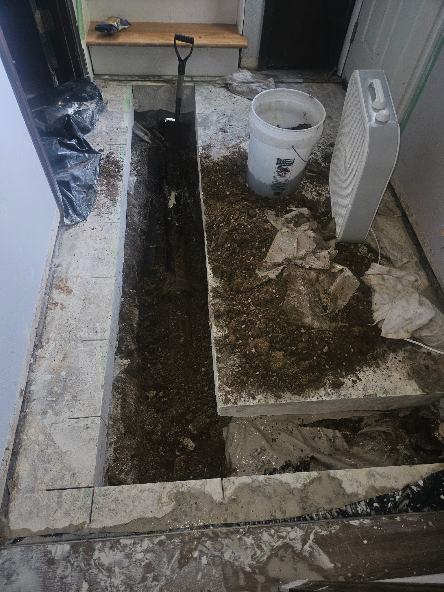 Concrete floor carefully opened to access a damaged drain line