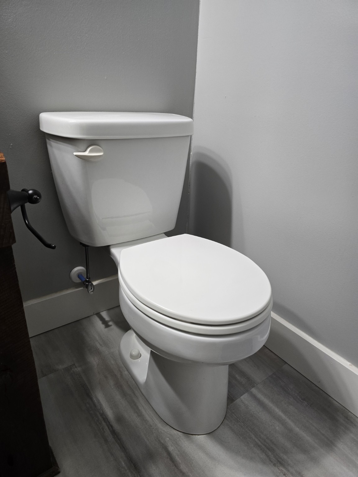 Completed toilet installation by Curfman Plumbing and Septic